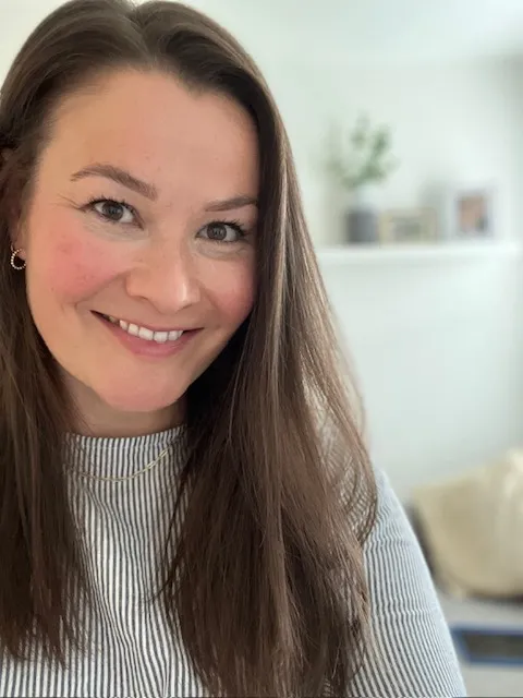 Sarah, in her home office